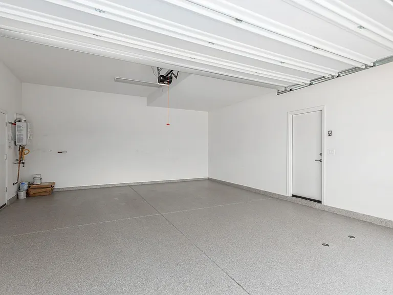 2' extended garage to 23'4", fits SUVs, most trucks. Epoxy clear coating floors. 8' door. 2 vehicles max, garage parking only.