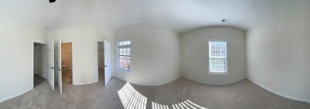 Master Bedroom with all sides (entrance door, rest room with standing shower, closet, side wall with window, front facing wall with window, and a side wall