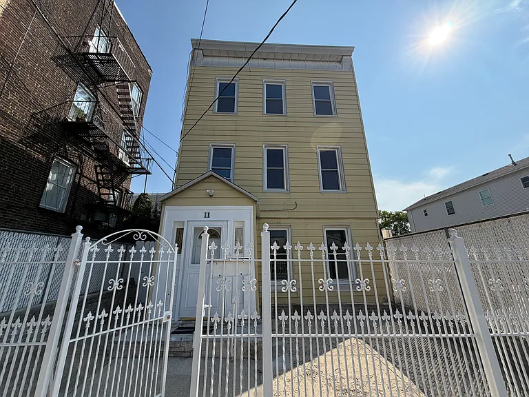 completely fenced in property with a bonus front patio!