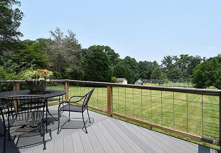 Back deck looks out over the greenhouse