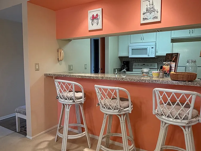 Kitchen w/ pantry & breakfast bar to enjoy morning coffees and stunning lake/golf course views!