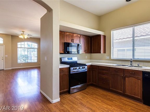 Kitchen has laminate flooring...