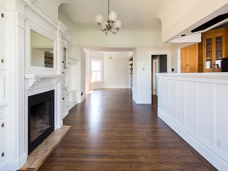 Great room -- 2 large rooms, kitchen off to right. Windows on all sides.