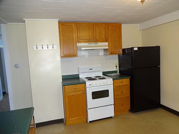 24" range with hood; nice fridge!