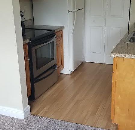 kitchen (door in the back leads to washer/dryer hookups))