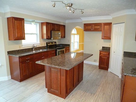 Kitchen has new cherry cabinets and granite counters 
