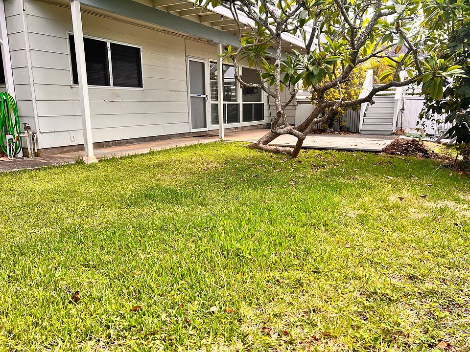 Yard, deck and front entry door for 2 bedroom unit.