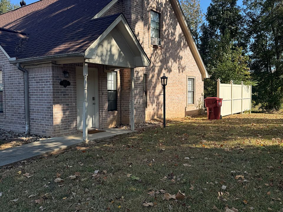 View of Front door and side of Townhouse. Privacy fence from traffic.