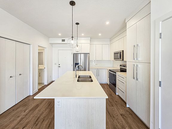 5th image of 681 Savanna Blvd NE Unit 1208
