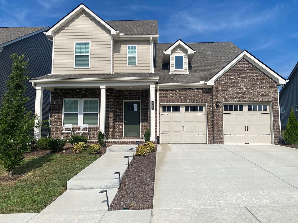 Main entrance. Double garage. Front porch seating. Entrance faces East. House is on a cul-de-sac so very peaceful and no traffic. No maintenance landscaping. Lawncare is included in rent price.