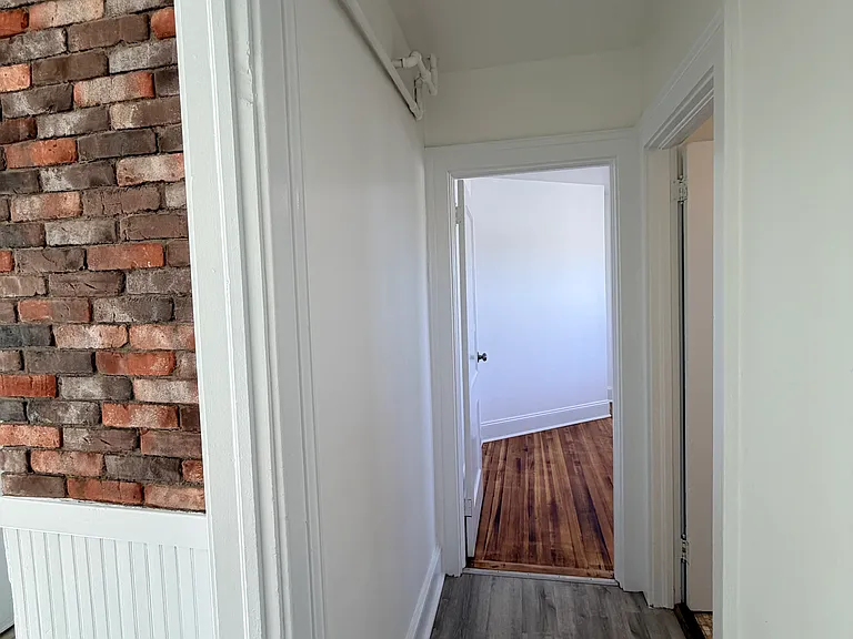 Hallway from second bedroom right of bathroom
