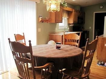 dining area off the kitchen with new patio door to deck