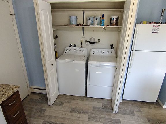 kitchen, washer and dryer in utility closet.