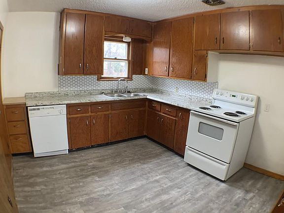 Updated kitchen with dishwasher and range.
