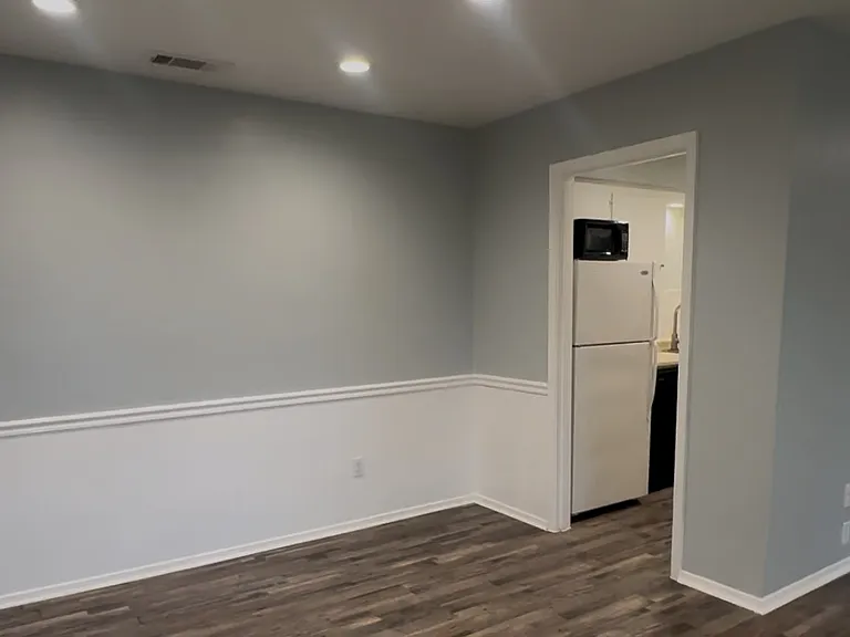 Recessed lighting in spacious dining area and living area