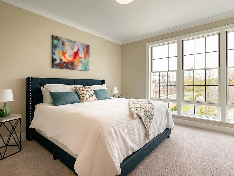 Master bedroom with king size bed, in suit bathroom with double sink and spacious shower and big walk in closet.