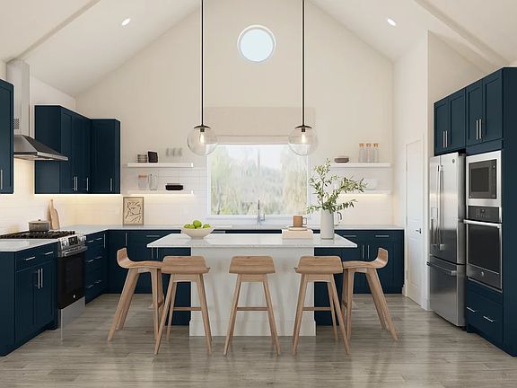 Kitchen with vaulted ceiling and pendant lighting