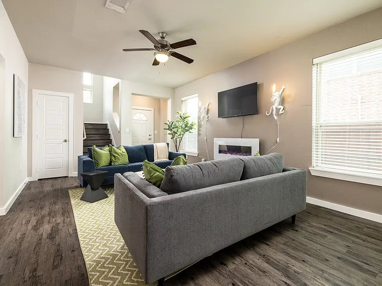 Cozy up by the fireplace and use the 50" Roku Smart TV for movie nights!