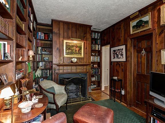 Study with wood burning fireplace