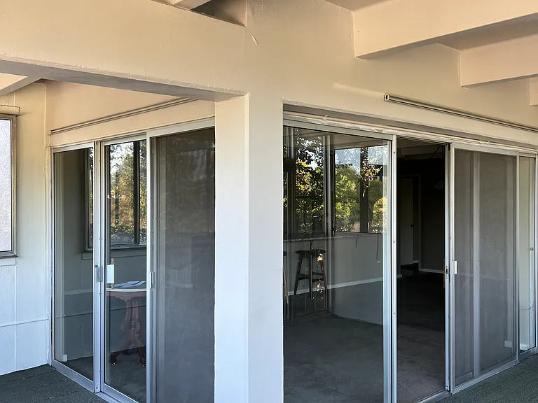 Corner sliders from balcony to living area