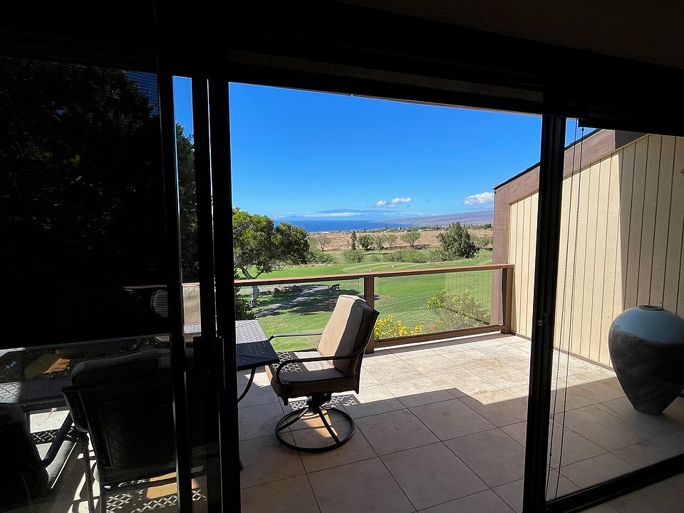 Spacious lanai with golf course, ocean and mountain views.