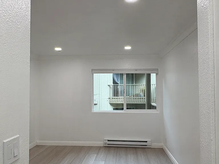 View leading into the bedroom with more recessed lighting