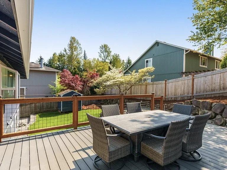 Fully fenced backyard with large deck fence entertaining and outdoor space.