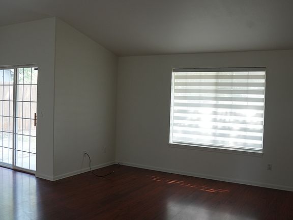 Main living space with sliding door to the backyard