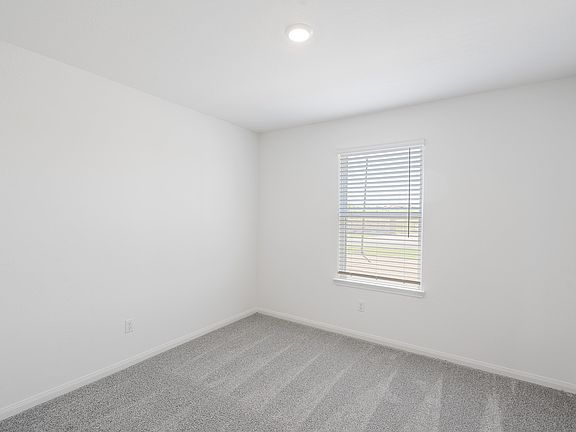 Each bedroom features lush carpet