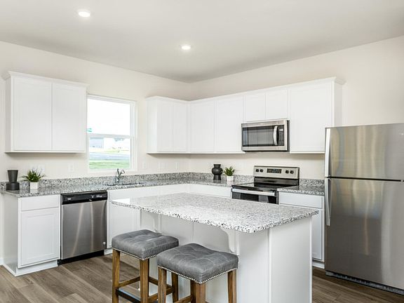 Package A Kitchen with beautiful white cabinets and granite countertops - Model Representation