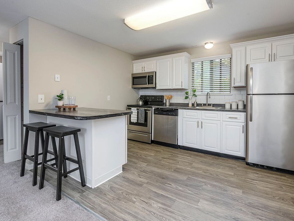 The Woodhaven Kitchen is where charm meets function, with wood-style flooring and inviting granite-style countertops.