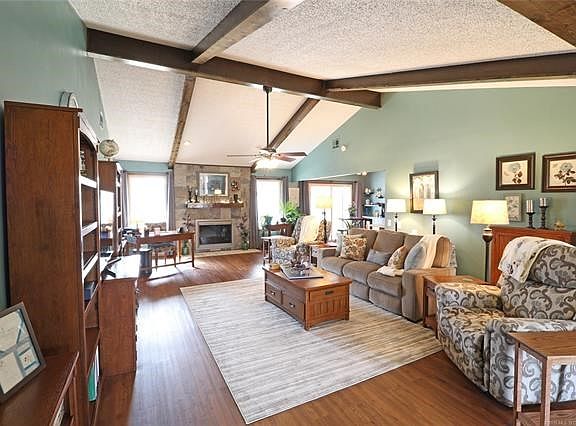 Living Room from Front Entry Hall:  Smooth entry from foyer.  Floor has been raised to all one level.  Wood Laminate flooring.