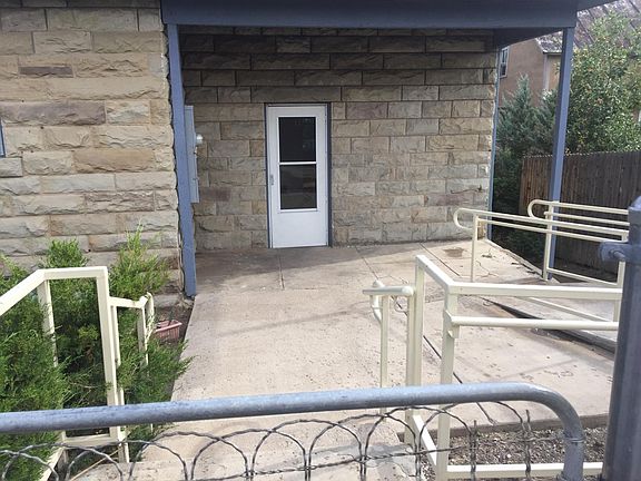 Main entrance with handicap ramp on right side.