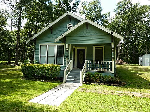Path leads to steps and porch of this cute home built in 1994
