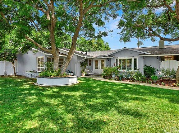Large front lawn with mature trees