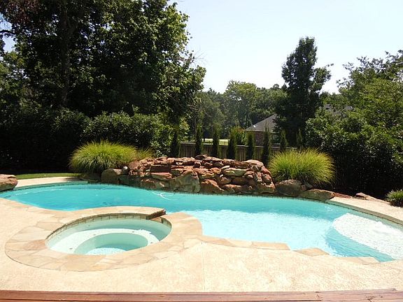 Gorgeous pool with waterfall and spa