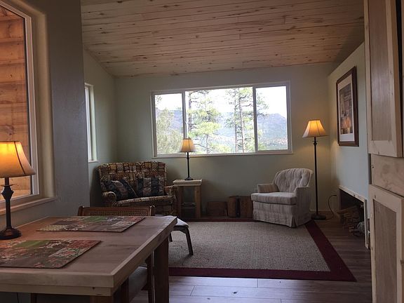 Living/dining, wood stove, ceilings, floors