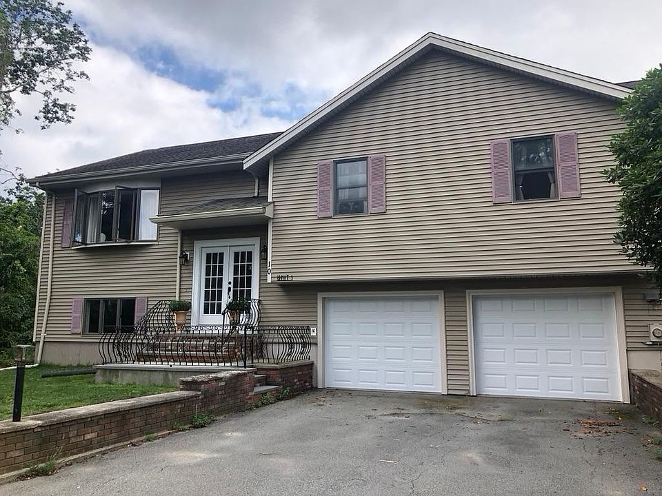 Front with 2 car garage and entry