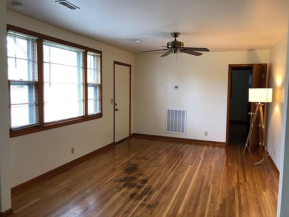Living room next to dining room. Front door and hall entrance off living room.