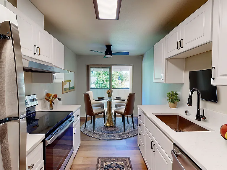 Experience modern elegance in this stylish kitchen and dining space. Experience modern elegance in this stylish kitchen and dining space.