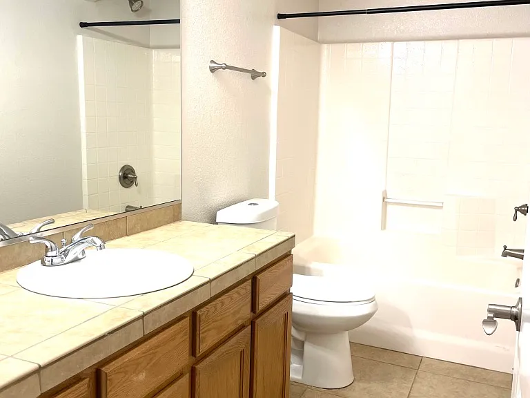 hall bathroom with tub and shower