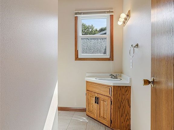 Half bath is conveniently located between kitchen and living/dining room.