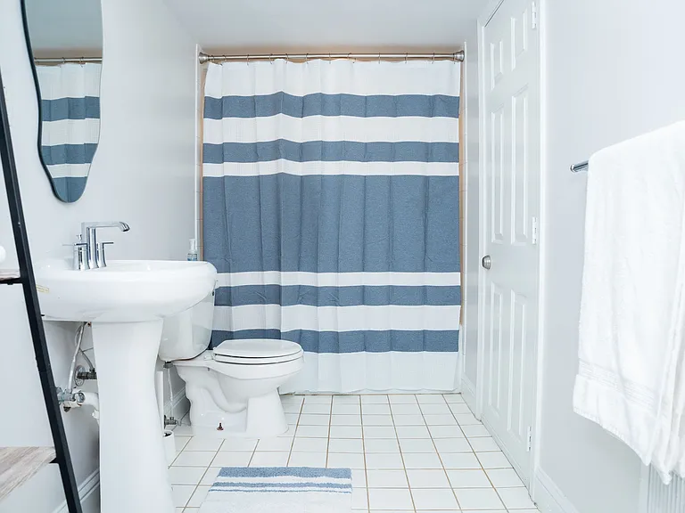 Full size bathroom with tub.