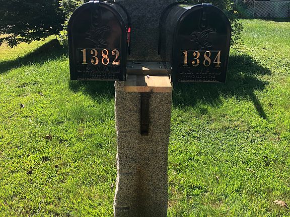 Adjacent rental property showing shared mailbox post