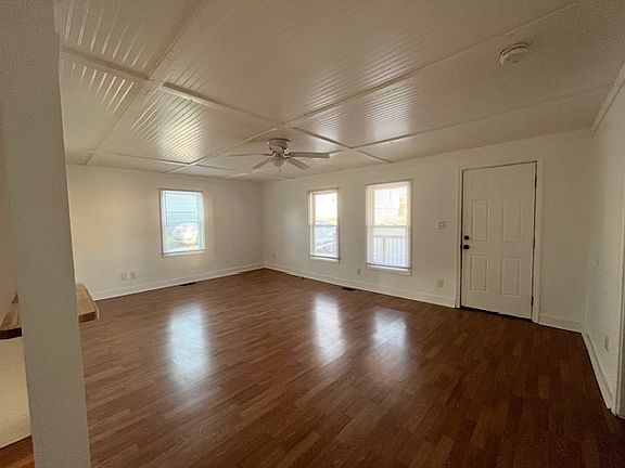 Large family room area with open layout to kitchen.