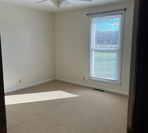 One of four large bedrooms