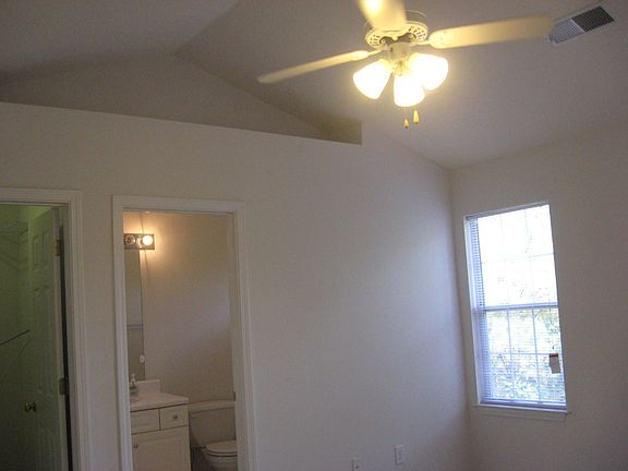 Master with vaulted ceiling and niche!