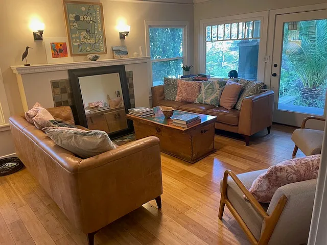 Light-filled living room overlooking meadow