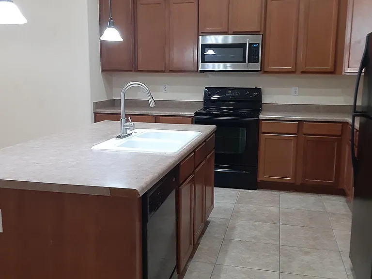 Kitchen with new steinless steel microvawe,large dining area and kitchen island