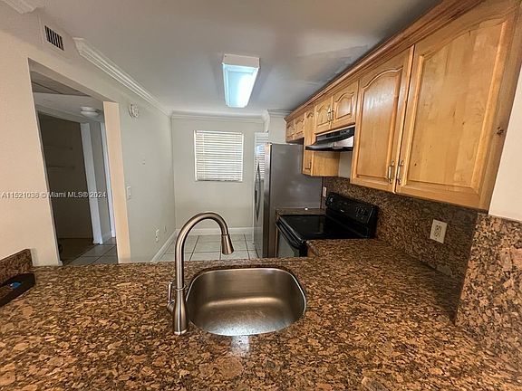 2nd image of 911 NE 209th Ter APT 102-27